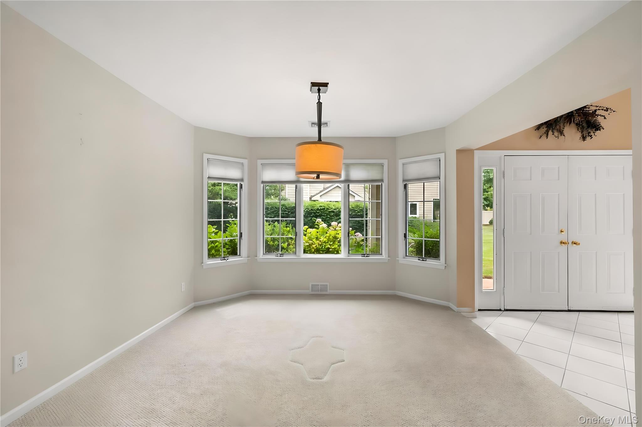 34 Cedar Ridge Lane Bay Shore, NY 11706 - Photo 9 of 27 a view of room with window and ceiling fan