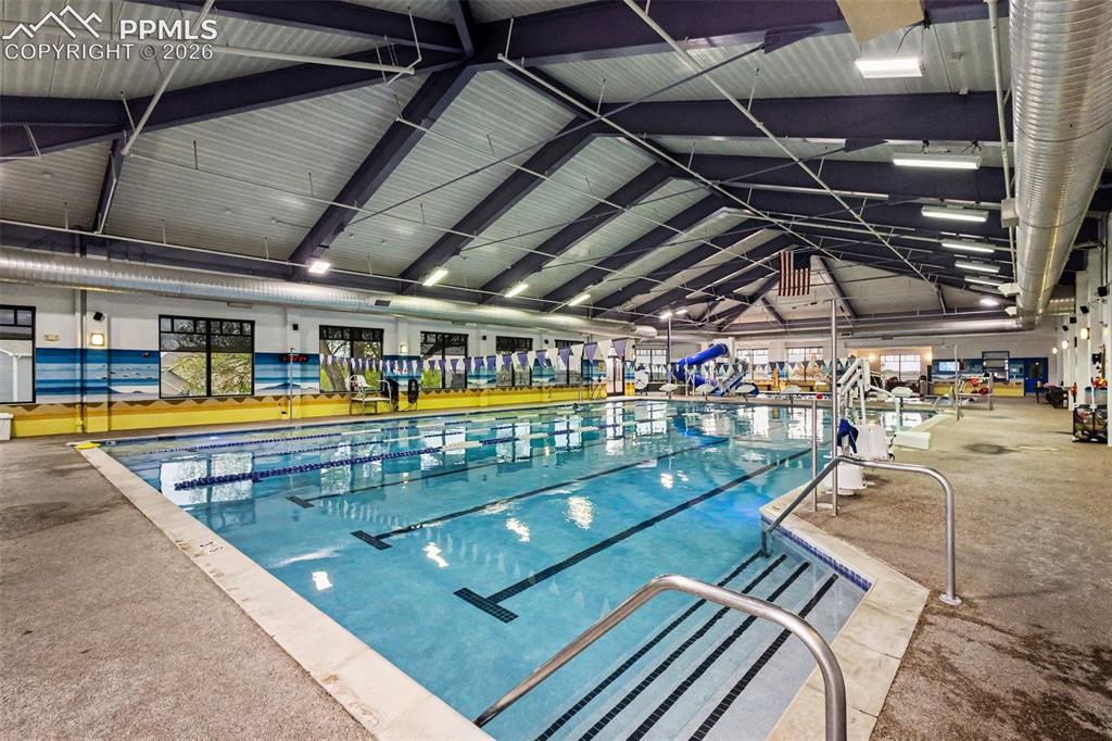 12210 Crystal Downs Road Peyton, CO 80831 - Photo 32 of 40 a view of a swimming pool with a patio