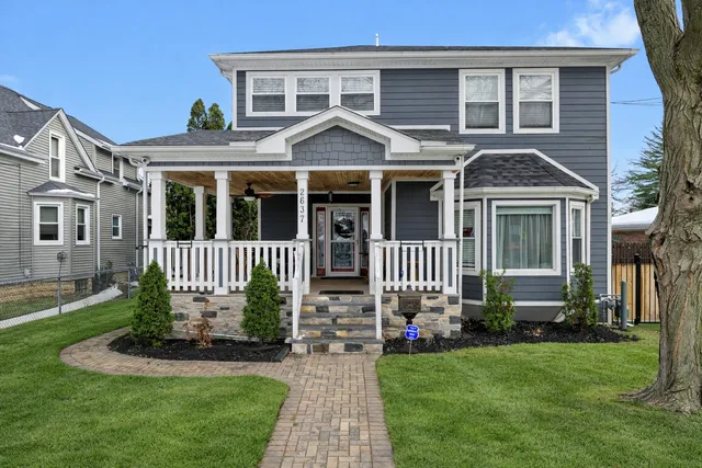 front view of a house with a yard