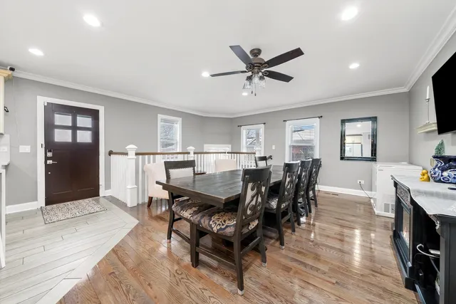 a view of a dining room with furniture and wooden floor