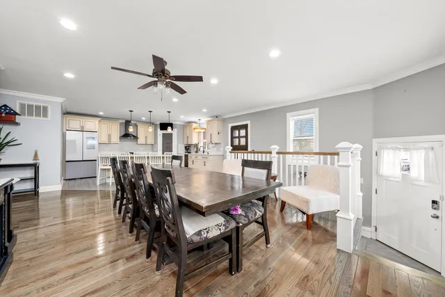 a view of a livingroom with furniture and a flat screen tv