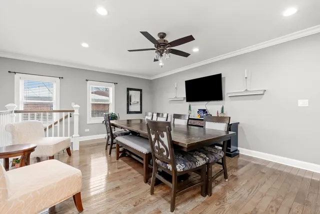 a kitchen with kitchen island a counter top space a sink stainless steel appliances and cabinets