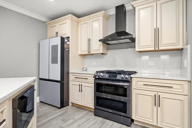 a large kitchen with stainless steel appliances kitchen island granite countertop a stove and a sink