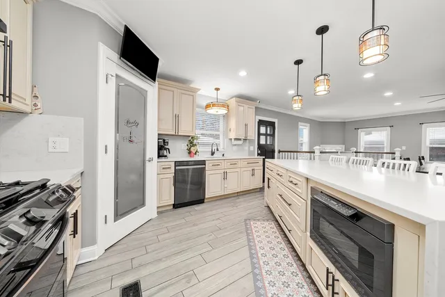 a kitchen with cabinets and window
