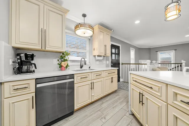a spacious bathroom with a double vanity sink toilet mirror and shower