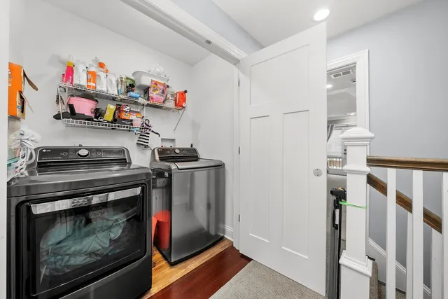 a bedroom with a large bed and a tv