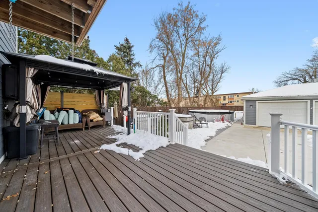 a view of a room with lots of wooden furniture