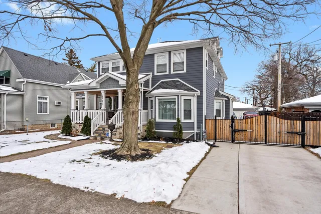 a view of a patio with table and chairs and wooden floor