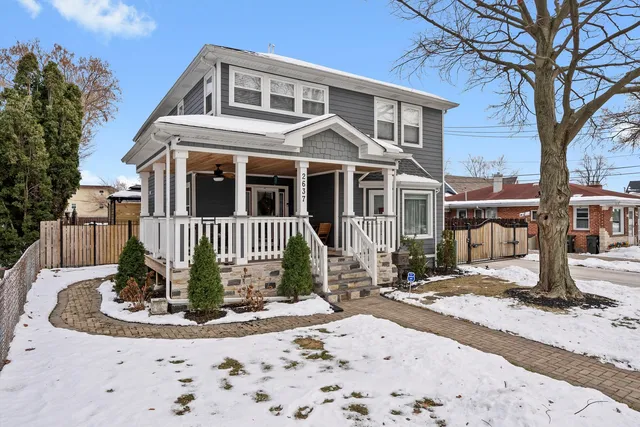 a balcony with furniture and wooden floor