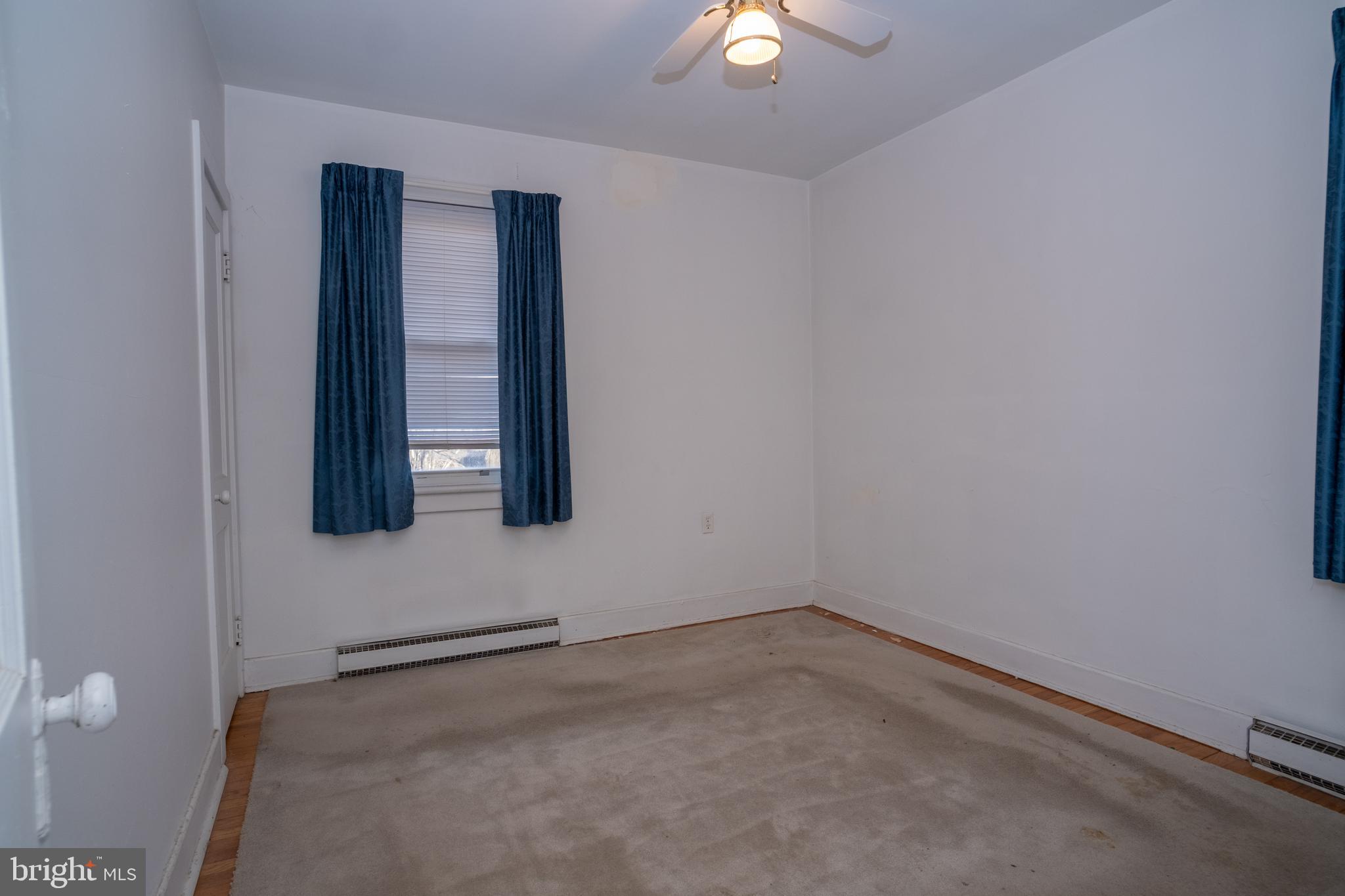 12401 Wright Avenue Cumberland, MD 21502 - Photo 11 of 17 an empty room with windows