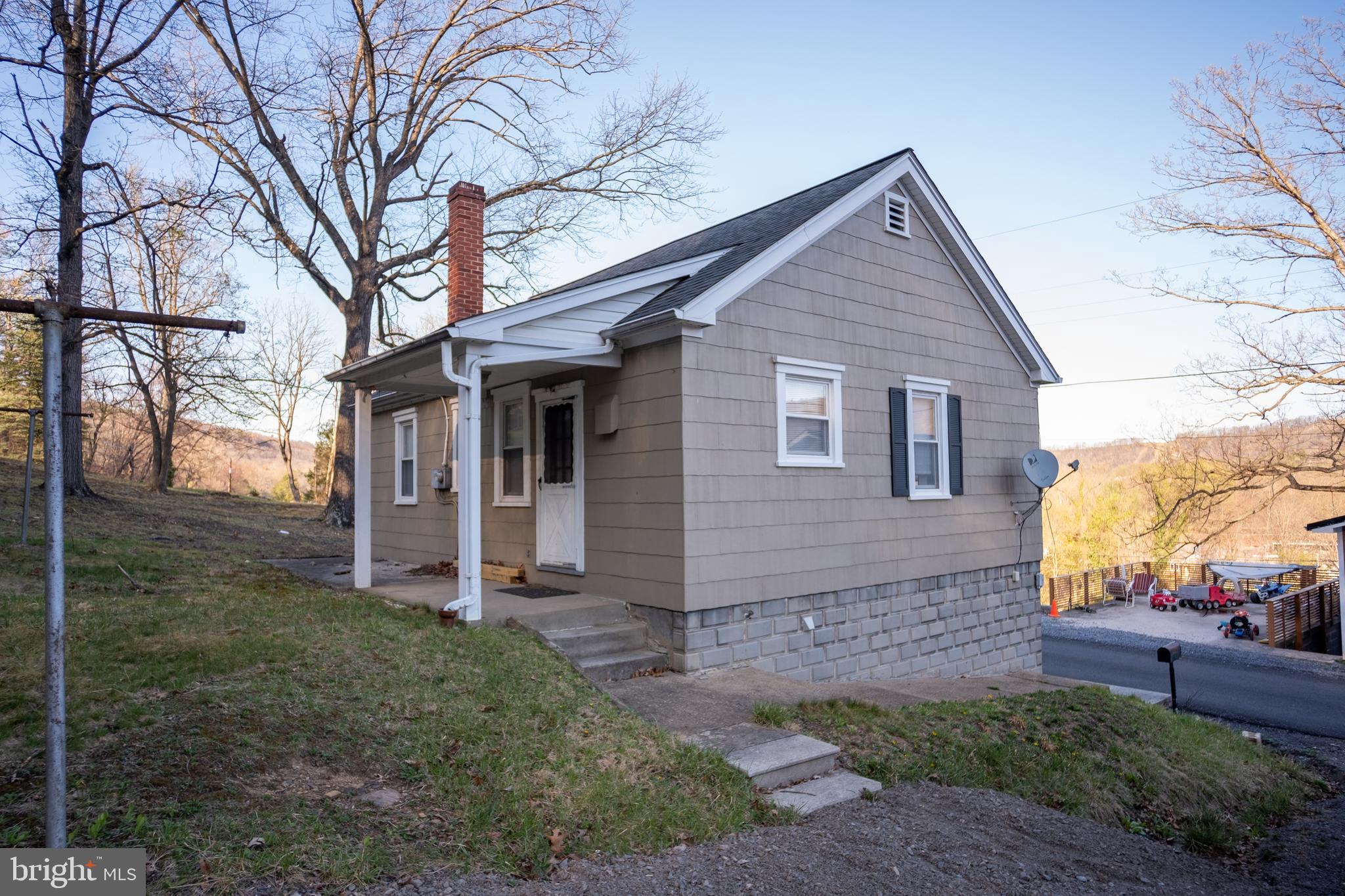 12401 Wright Avenue Cumberland, MD 21502 - Photo 2 of 17 a view of a house with a yard