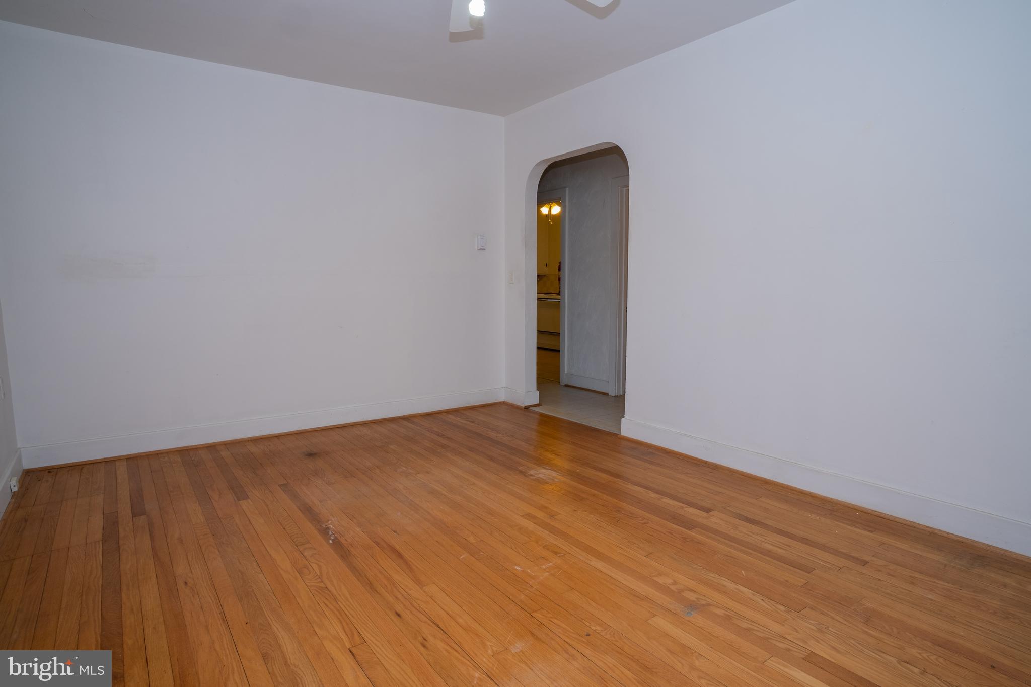12401 Wright Avenue Cumberland, MD 21502 - Photo 9 of 17 a view of an empty room with wooden floor