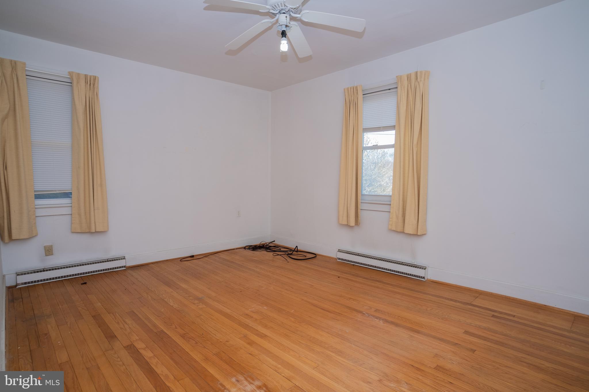 12401 Wright Avenue Cumberland, MD 21502 - Photo 10 of 17 wooden floor in an empty room with a window