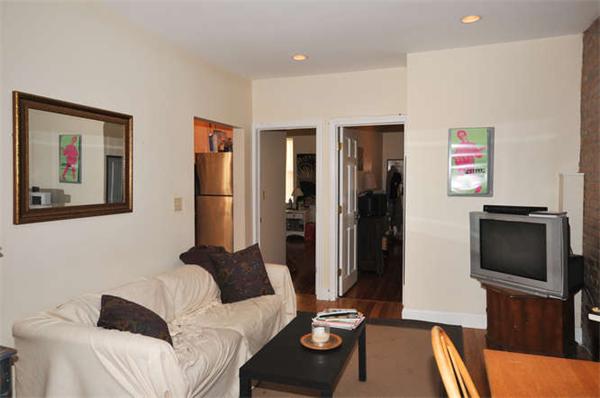 25 Clark Street, Unit 9 Boston, MA 02113 - Photo 1 of 1 a living room with furniture and a flat screen tv