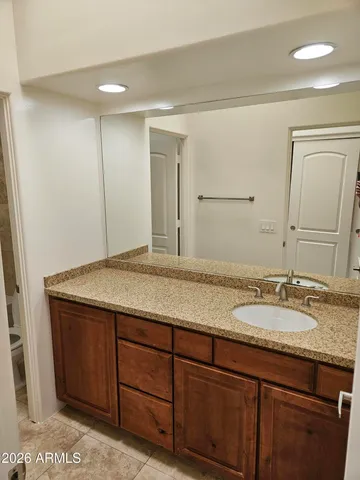 a bathroom with a bathtub and a sink