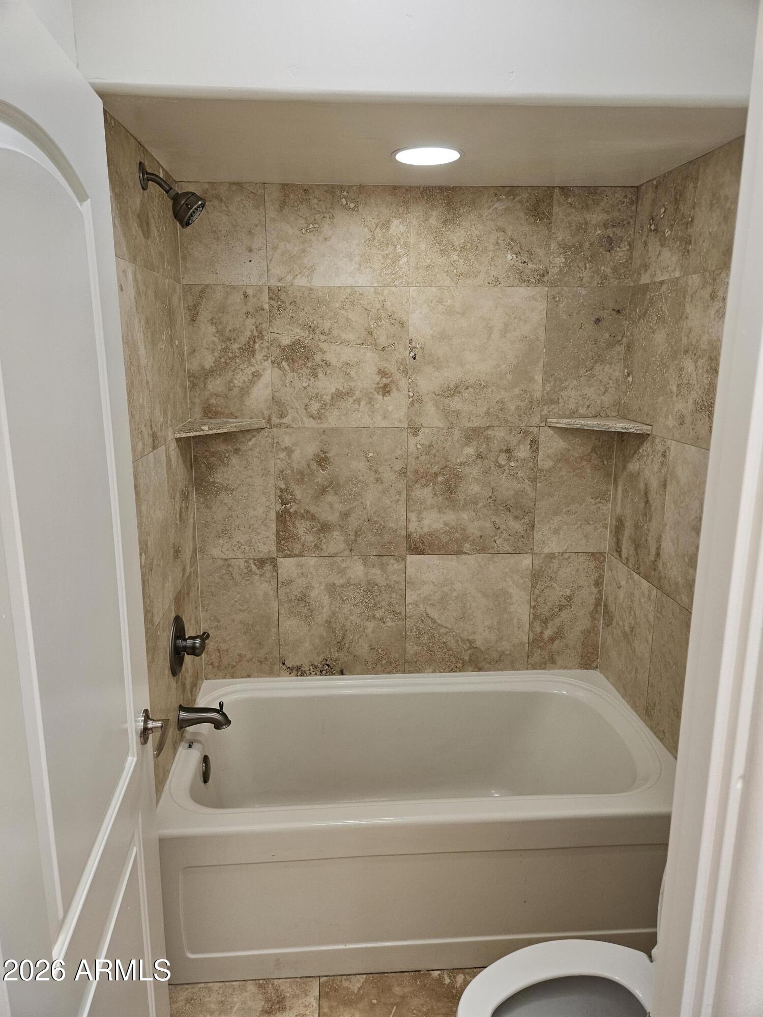 4113 North 22nd Street, Unit 5 Phoenix, AZ 85016 - Photo 29 of 60 a bathroom with a tub a toilet and a shower