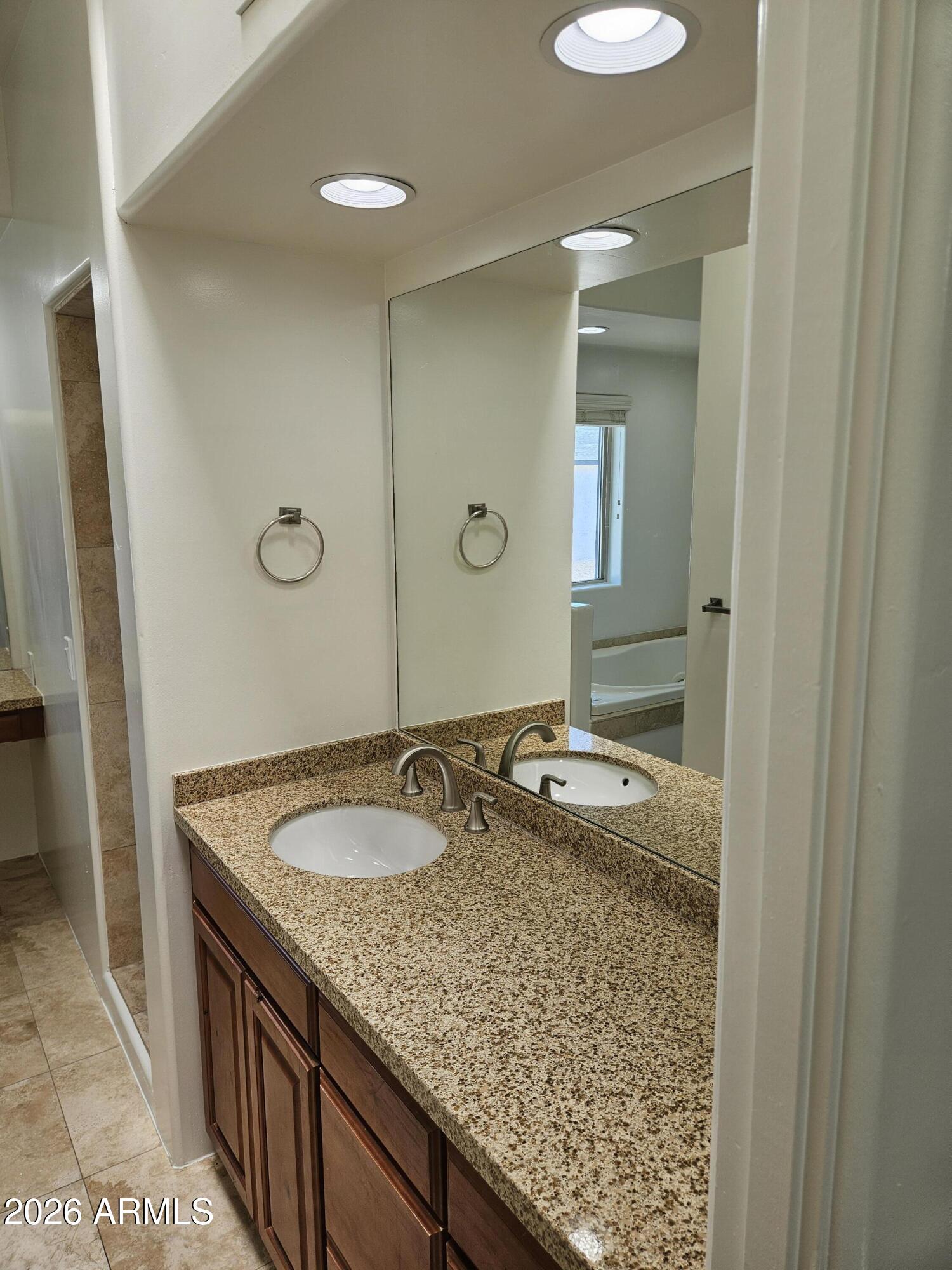 4113 North 22nd Street, Unit 5 Phoenix, AZ 85016 - Photo 38 of 60 a bathroom with a granite countertop sink and a mirror