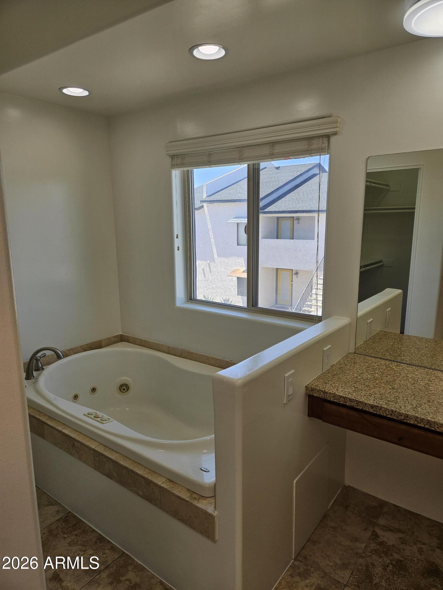 4113 North 22nd Street, Unit 5 Phoenix, AZ 85016 - Photo 40 of 60 a bathroom with a tub sink and mirror