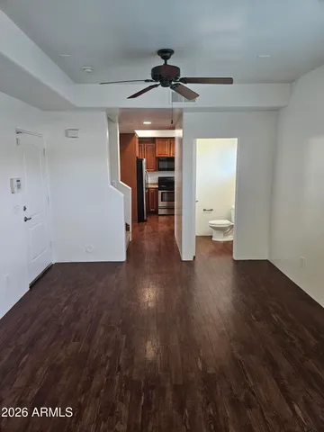 a white toilet sitting next to a bathroom sink