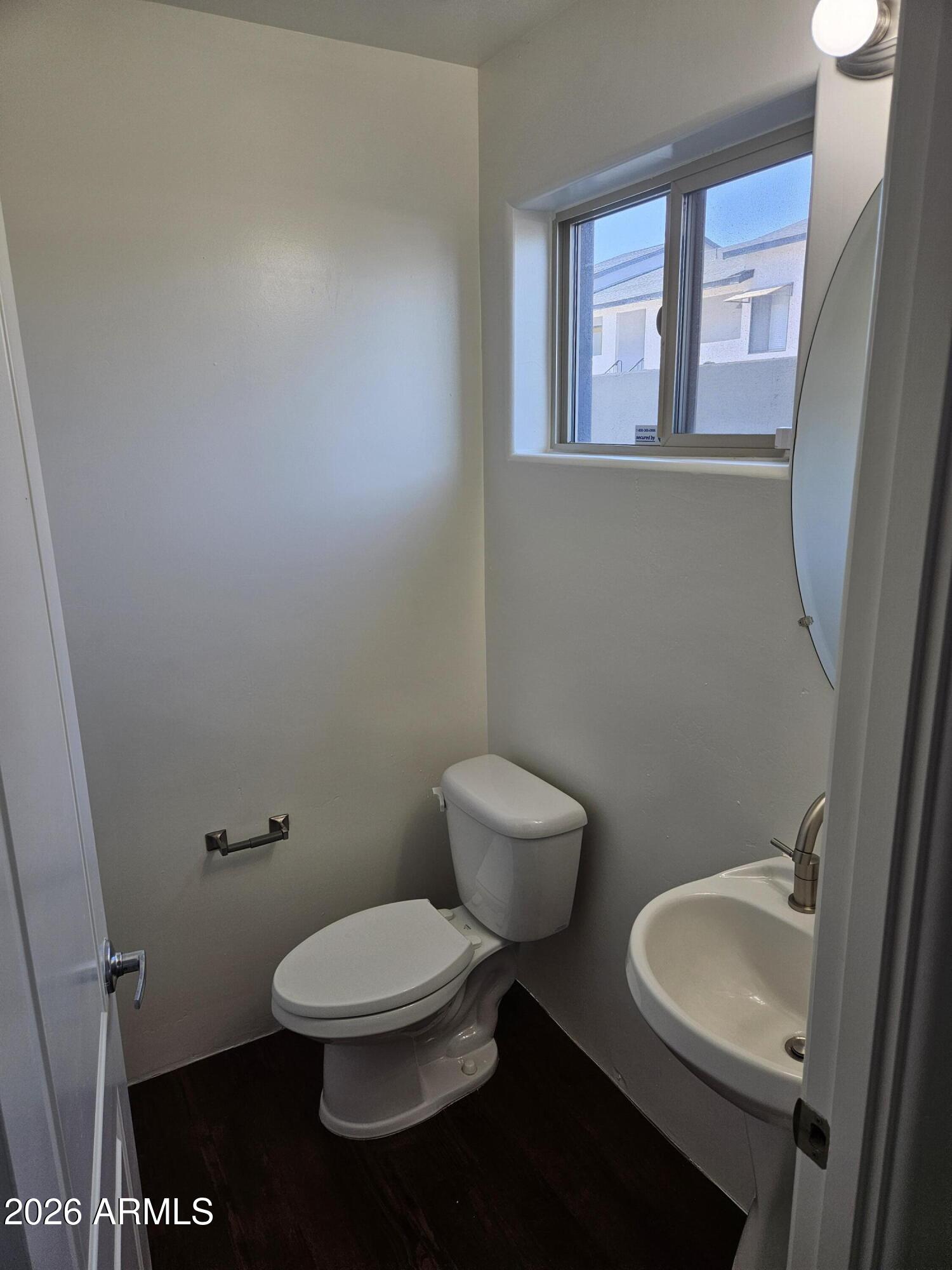 4113 North 22nd Street, Unit 5 Phoenix, AZ 85016 - Photo 10 of 60 a white toilet sitting next to a bathroom sink