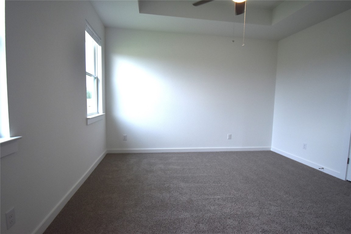 18113 Emu Lane Manor, TX 78653 - Photo 11 of 20 an empty room with windows and closet