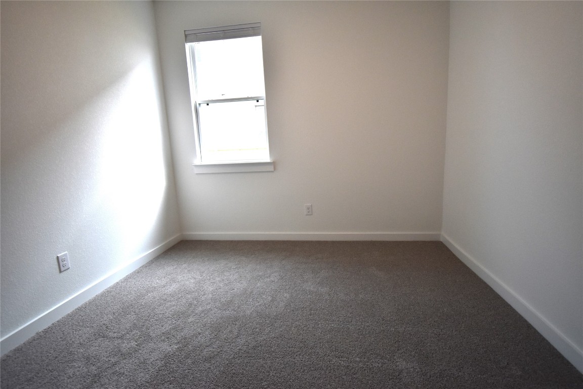 18113 Emu Lane Manor, TX 78653 - Photo 15 of 20 an empty room with a window
