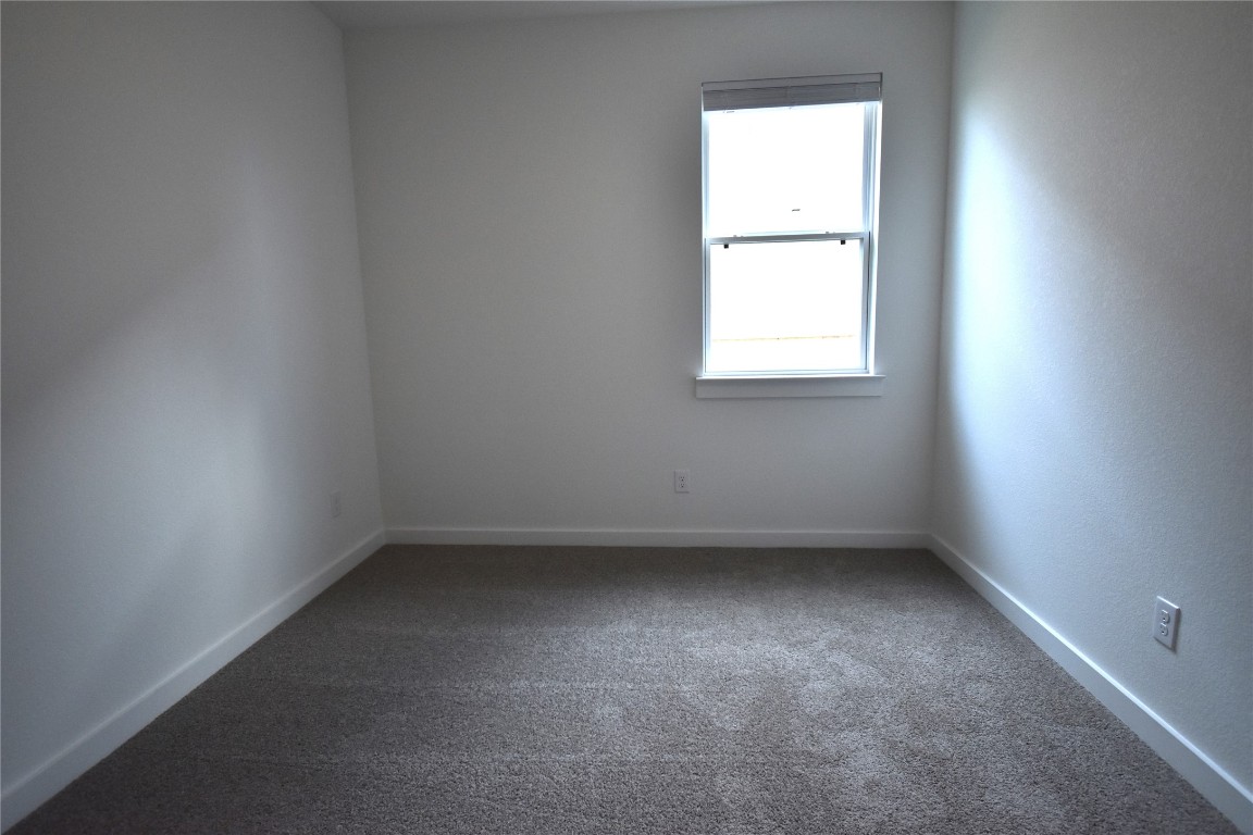 18113 Emu Lane Manor, TX 78653 - Photo 16 of 20 an empty room with a window