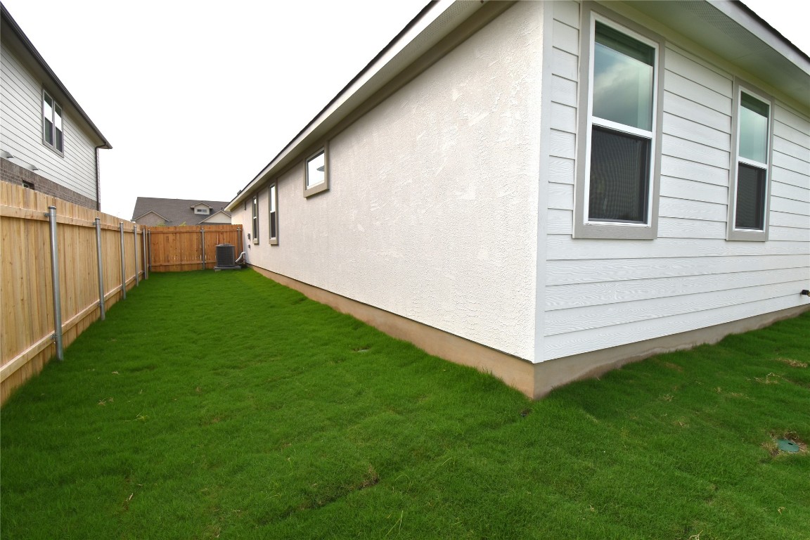 18113 Emu Lane Manor, TX 78653 - Photo 17 of 20 a view of a backyard with potted plants