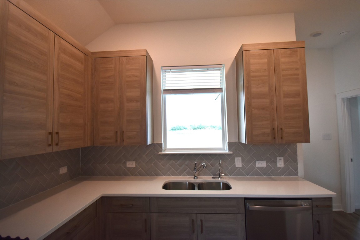 18113 Emu Lane Manor, TX 78653 - Photo 9 of 20 a bathroom with a sink and a mirror