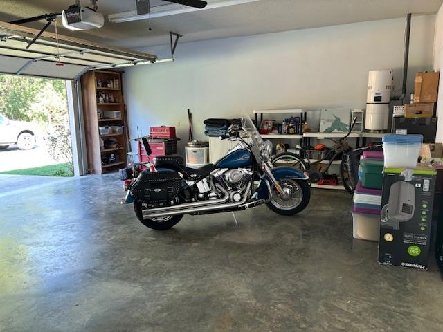 7980 Rankin Branch Road Millington, TN 38053 - Photo 24 of 28 Garage with ceiling fan and a garage door opener