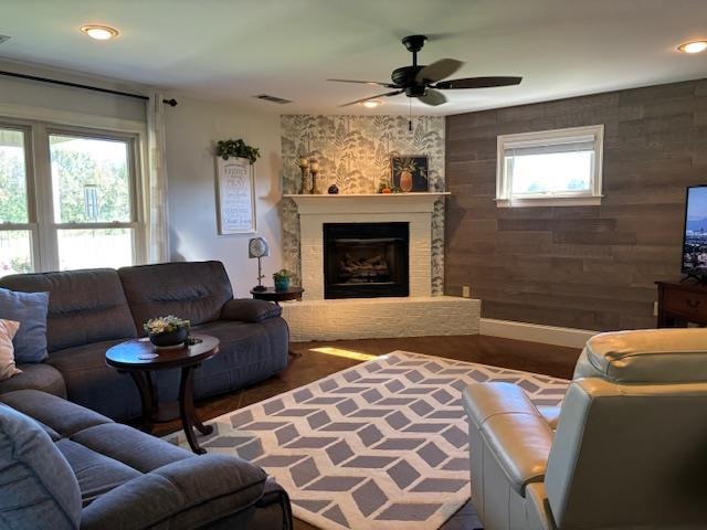 7980 Rankin Branch Road Millington, TN 38053 - Photo 3 of 28 Living room with a large fireplace, hardwood / wood-style flooring, and plenty of natural light