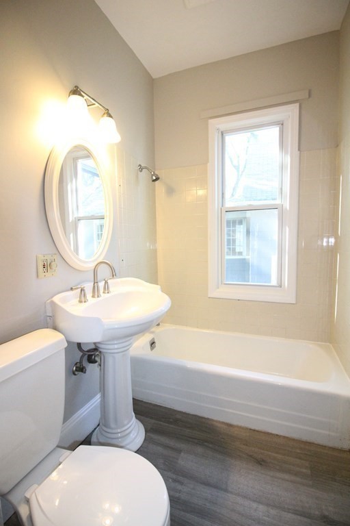 524 Armory Street Springfield, MA 01104 - Photo 4 of 11 a bathroom with a sink toilet and a mirror