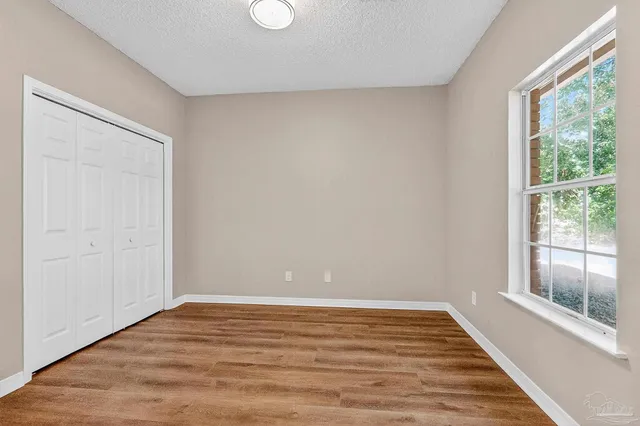 a view of a hallway with windows