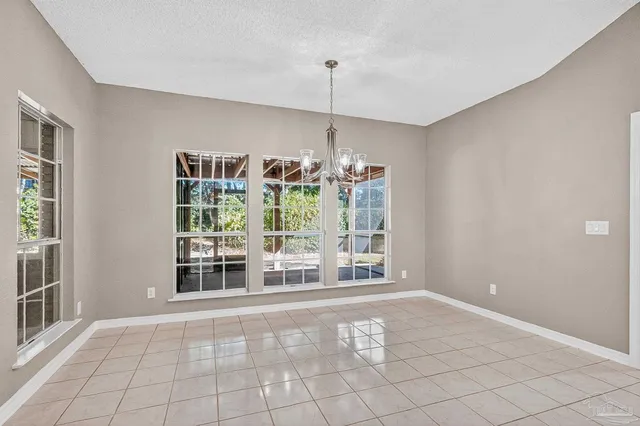 a kitchen with kitchen island a counter top space appliances and cabinets
