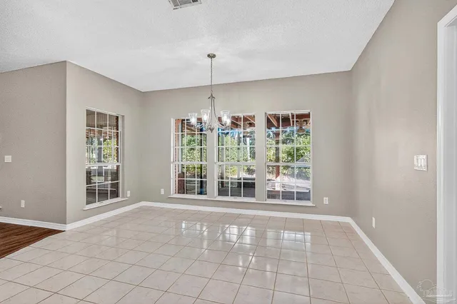 a kitchen with stainless steel appliances granite countertop a sink and a stove