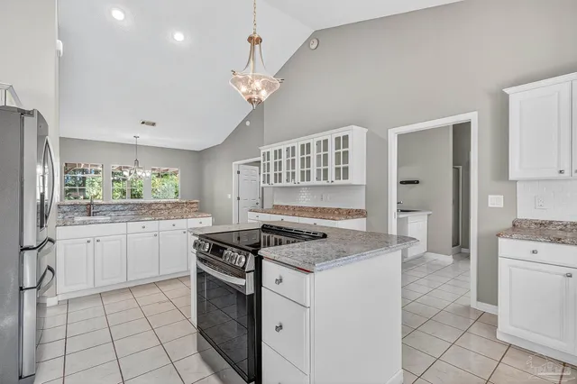 a view of a livingroom with window and a ceiling fan