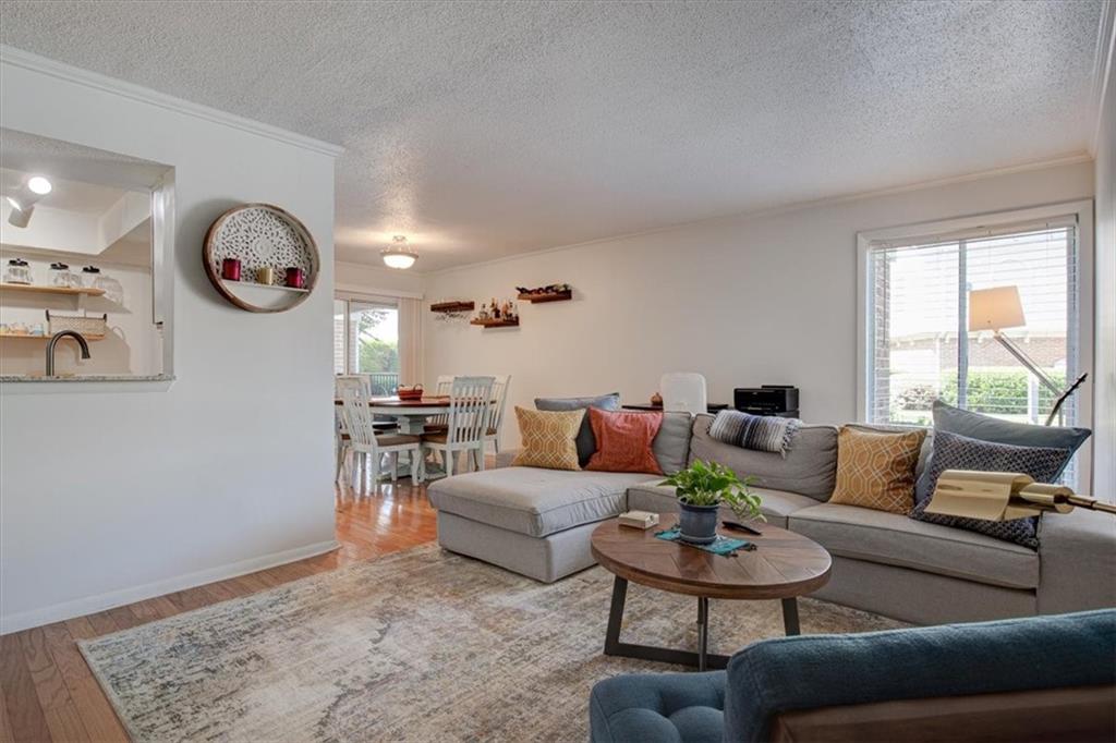 3301 Henderson Mill Road, Unit D1 Atlanta, GA 30341 - Photo 1 of 1 a living room with furniture and a table