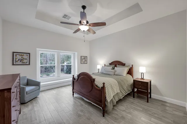 a bedroom with a bed and a couch