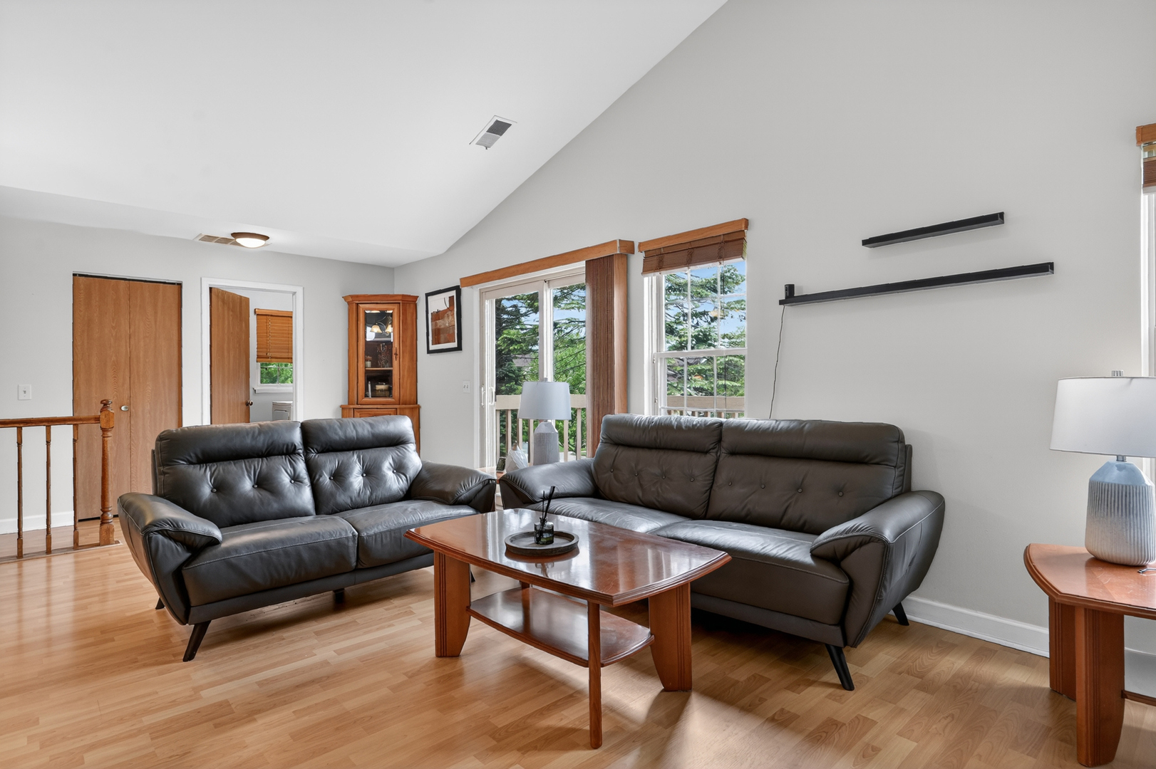 943 Ridgefield Lane, Unit 4 Wheeling, IL 60090 - Photo 6 of 38 a living room with furniture and a large window