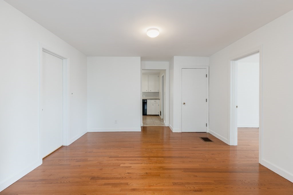 55 Morse Street, Unit 1 Watertown, MA 02472 - Photo 11 of 12 a view of empty room with wooden floor