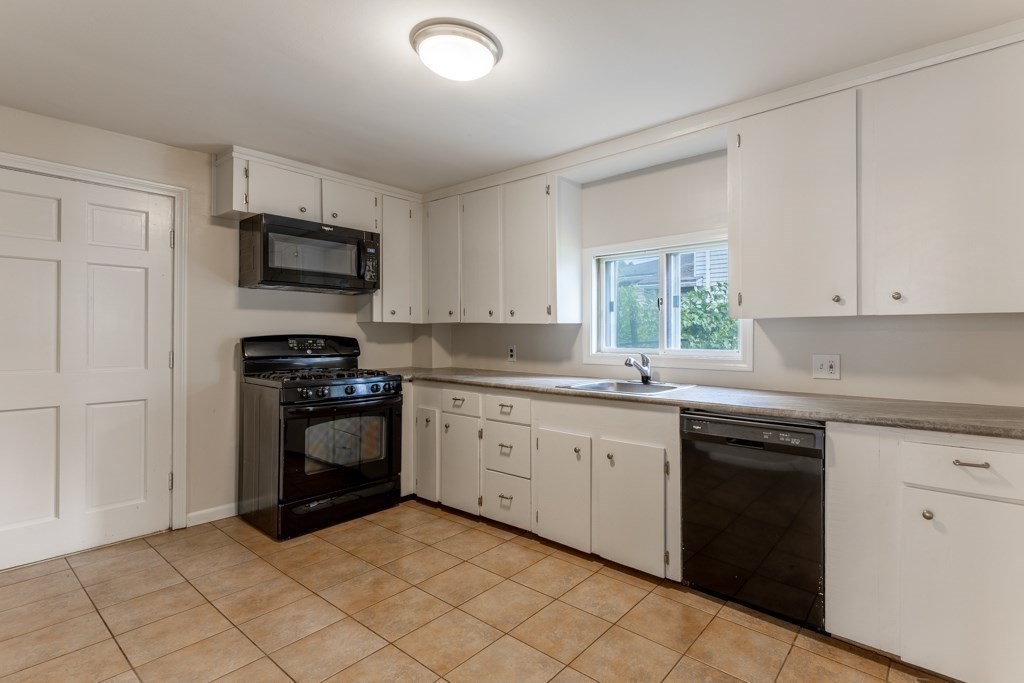 55 Morse Street, Unit 1 Watertown, MA 02472 - Photo 5 of 12 a kitchen with a sink stove and microwave
