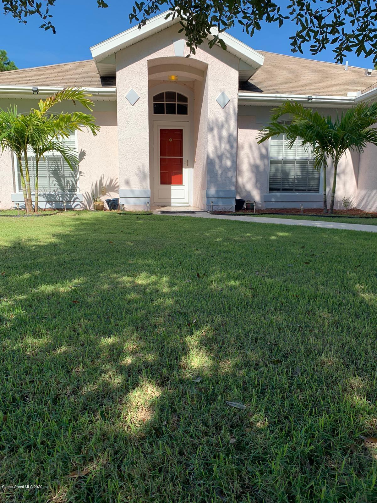 125 Tudor Road Southwest Palm Bay, FL 32908 - Photo 2 of 20 2144342a-eb4c-473d-bfbe-043ceec61a83 2