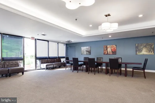 a view of a big room with furniture window and outside view