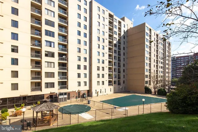 a view of a balcony with chairs and table