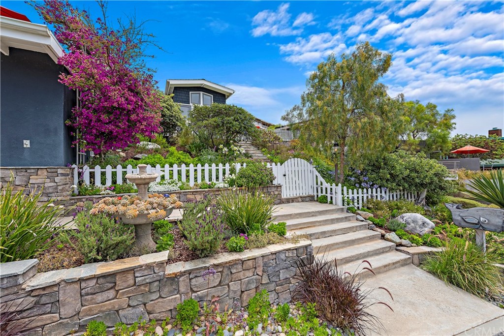 30852 Driftwood Drive Laguna Beach, CA 92651 - Photo 13 of 54 a front view of a house with garden
