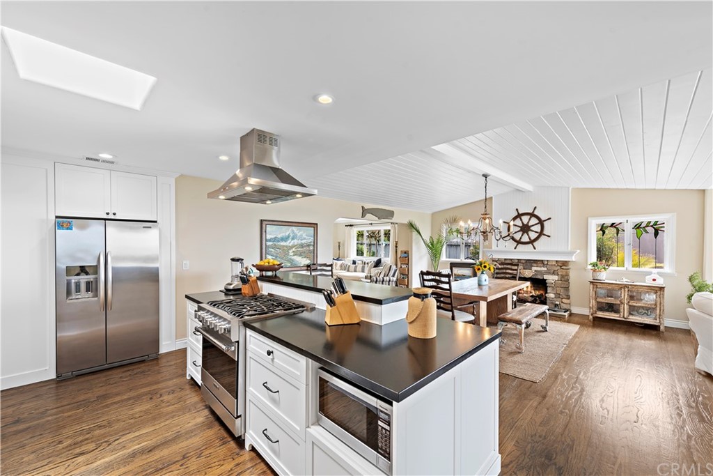 30852 Driftwood Drive Laguna Beach, CA 92651 - Photo 23 of 54 a kitchen with stainless steel appliances granite countertop a refrigerator a stove and a sink