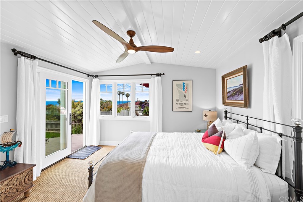 30852 Driftwood Drive Laguna Beach, CA 92651 - Photo 27 of 54 a bedroom with a bed and a large window