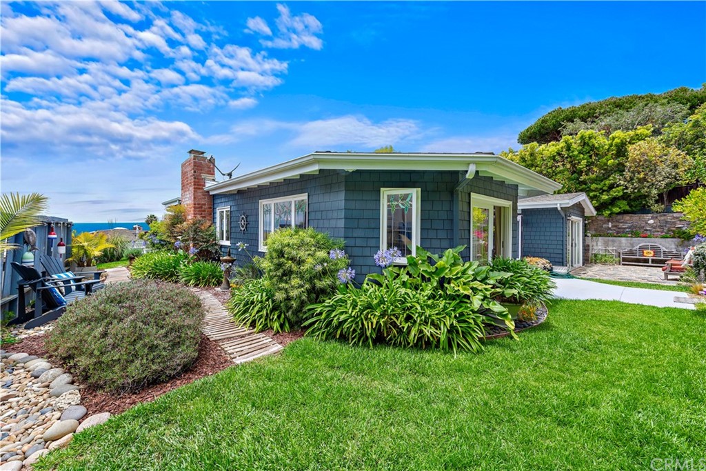 30852 Driftwood Drive Laguna Beach, CA 92651 - Photo 35 of 54 a front view of a house with garden