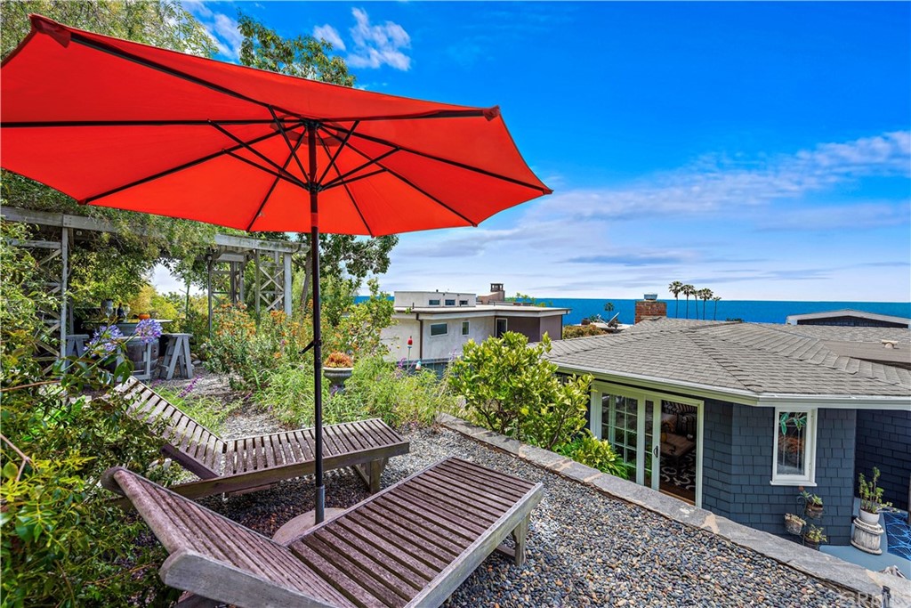30852 Driftwood Drive Laguna Beach, CA 92651 - Photo 39 of 54 a view of a balcony with furniture and umbrella