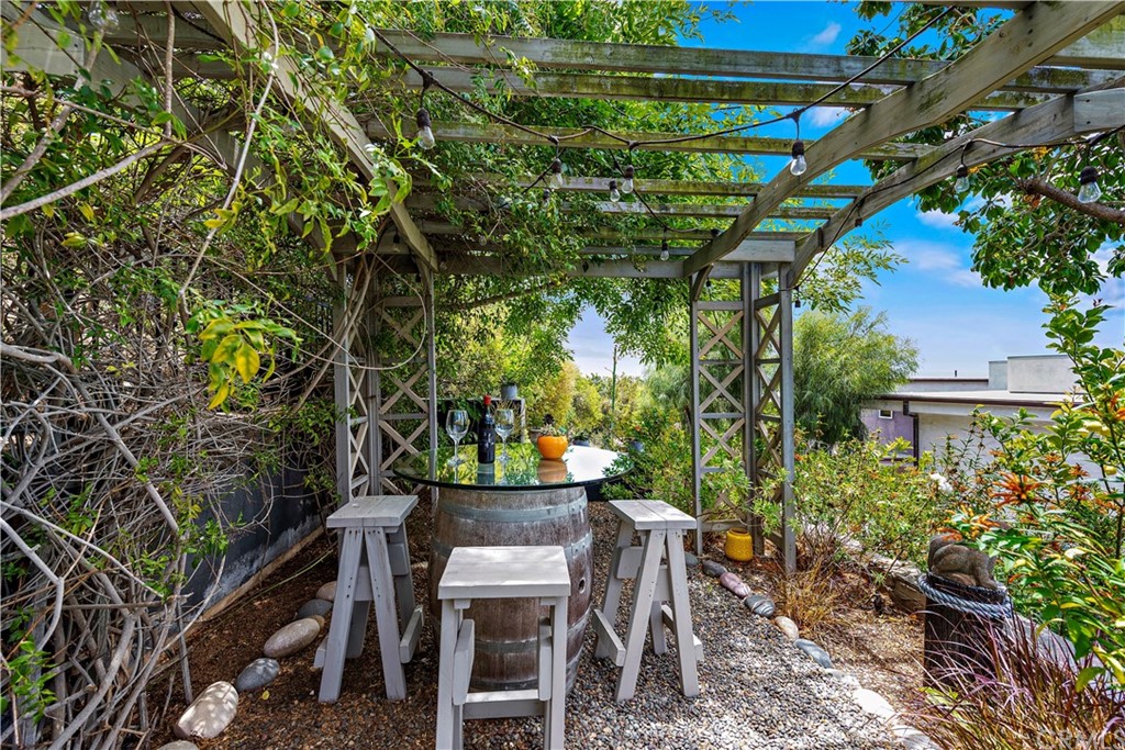 30852 Driftwood Drive Laguna Beach, CA 92651 - Photo 40 of 54 a view of a backyard with table and chairs and potted plants